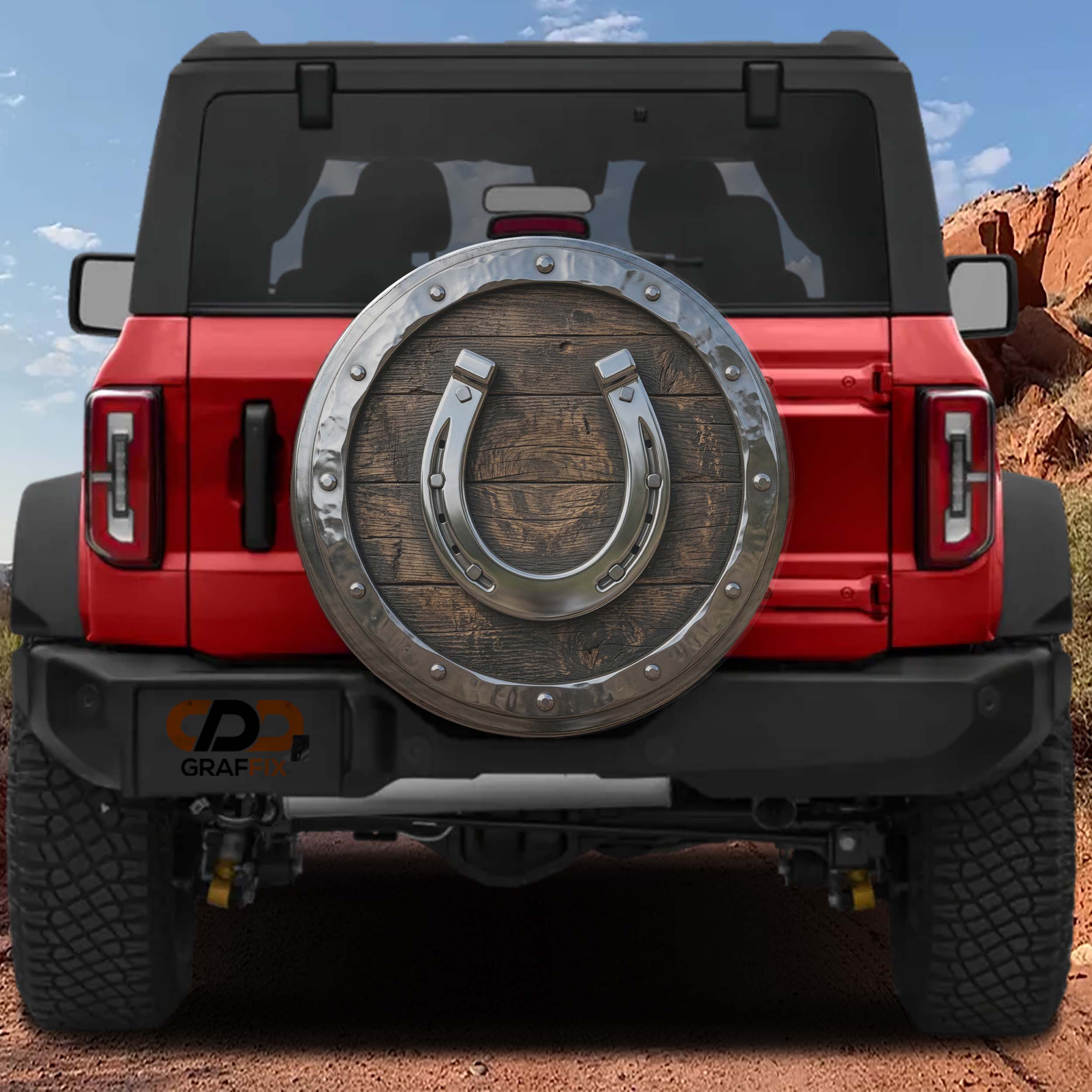 the back of a red Jeep Wrangler with a large wooden horseshoe-shaped spare tire mounted on the vehicle.