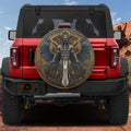 Egyptian pharaoh winged deity spare tire cover on a black Jeep Wrangler showing GRAFFIX rear bumper sticker