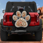 A red Jeep Wrangler with a floral paw print decal on the rear window.