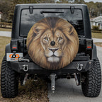 Lion of Judah spare tire cover mounted on black Jeep Wrangler rear gate with painted lion portrait art