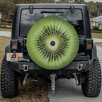 Kiwi fruit spare tire cover with green sliced kiwifruit graphic and seeded center design