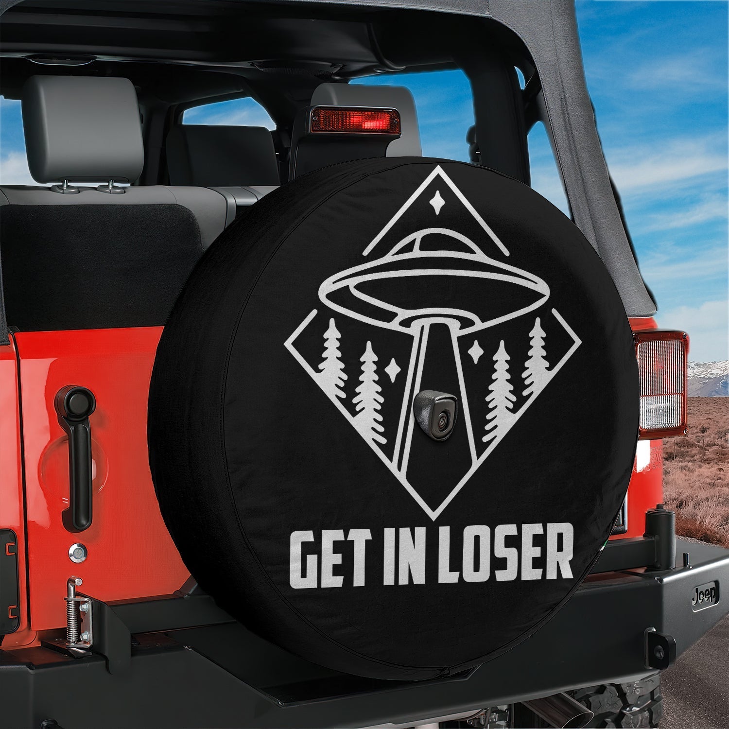 Get In Loser spare tire cover mounted on red Jeep rear with playful pink lettering and mean girls style script