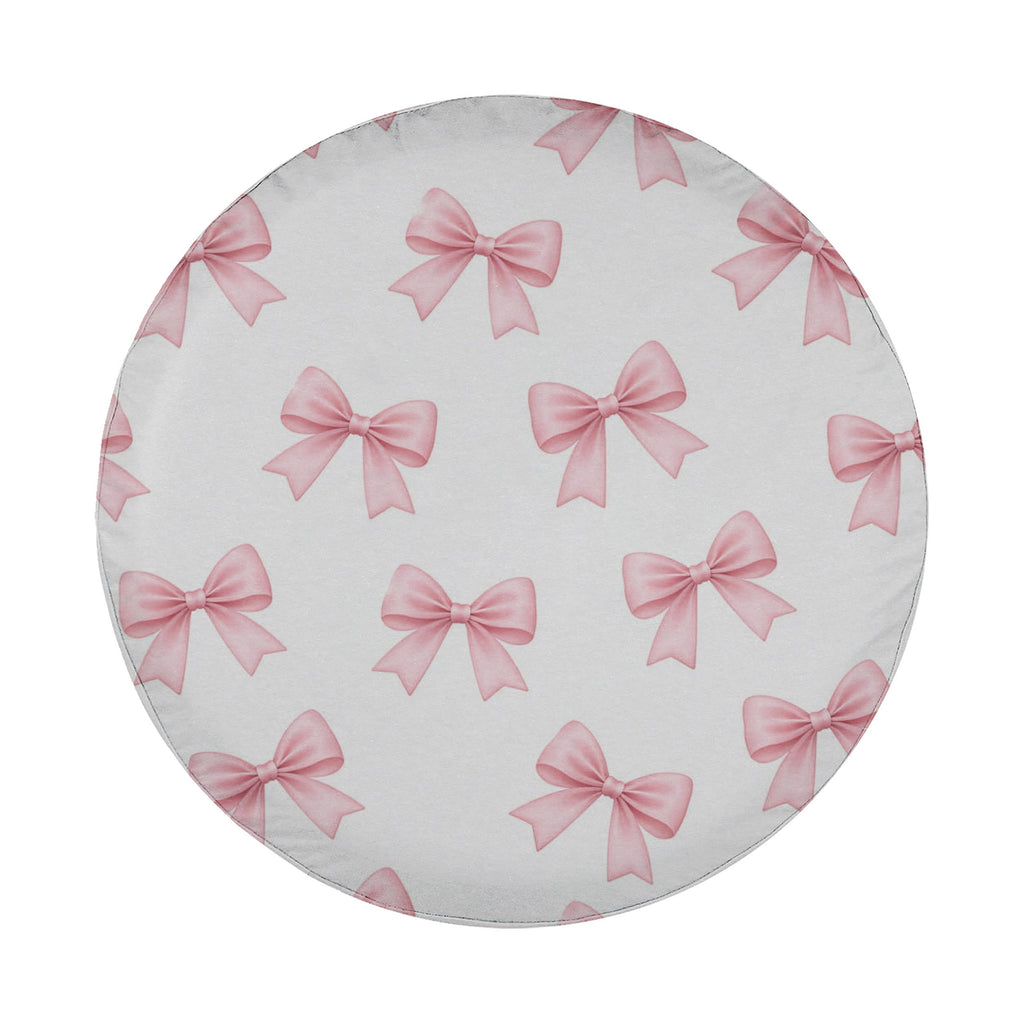 a circular pattern of pink bows on a white background.