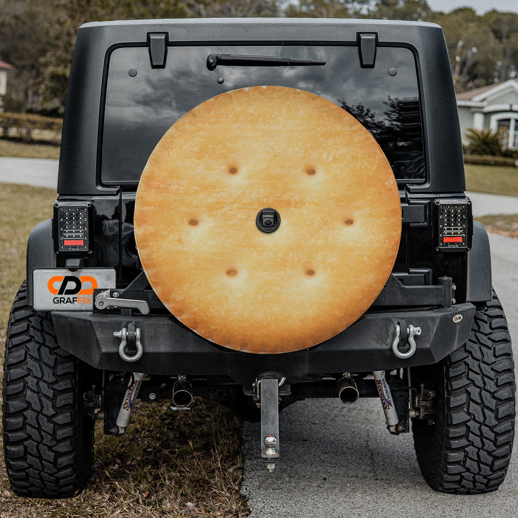 Buttery round cracker stack spare tire cover shown installed on rear of vehicle