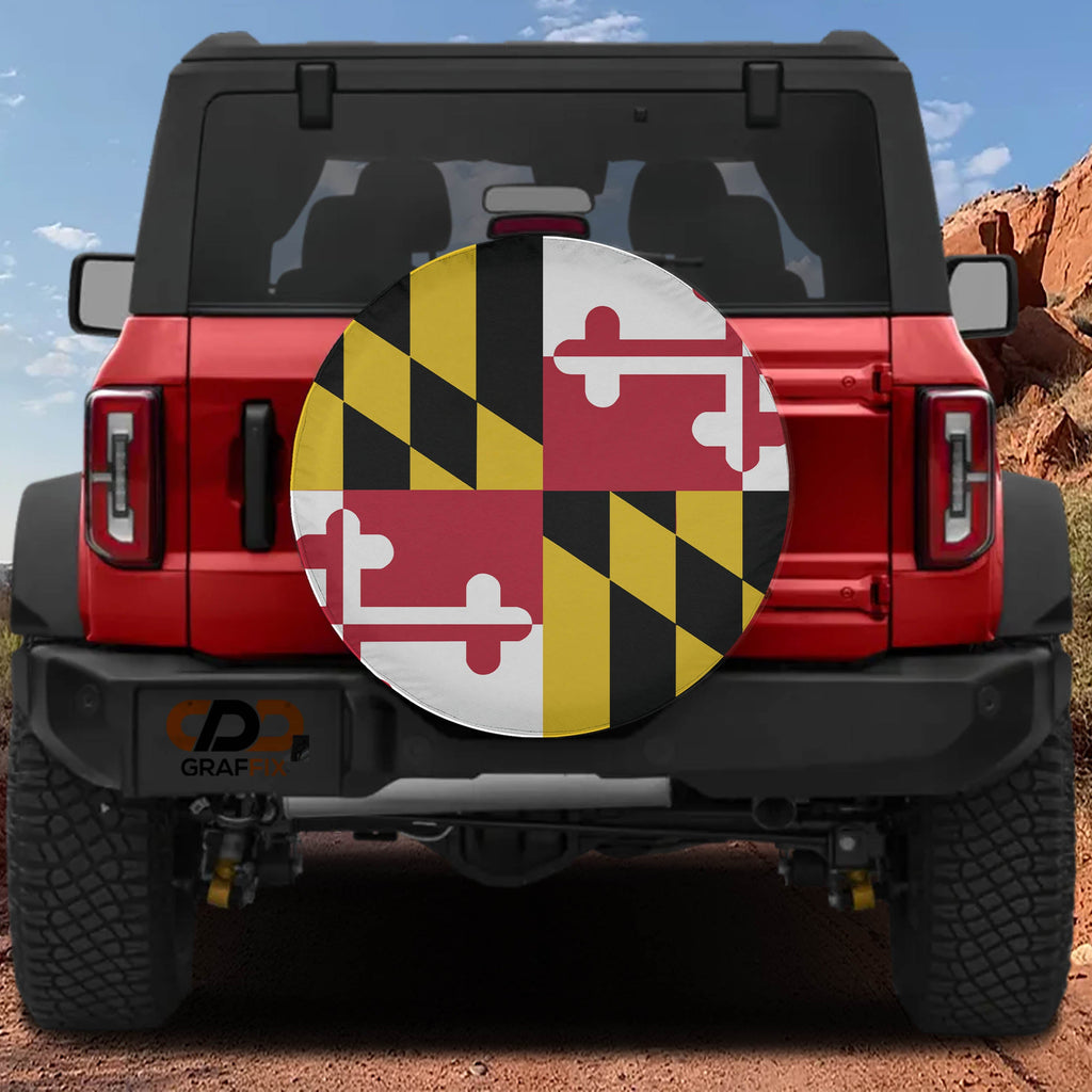 Maryland state flag spare tire cover mounted on red Ford Bronco rear with red rock canyon scenery