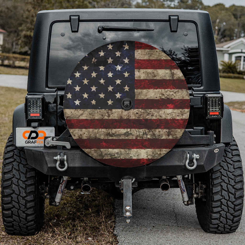 Black Jeep Wrangler with Rustic American Flag spare tire cover installed on rear bumper