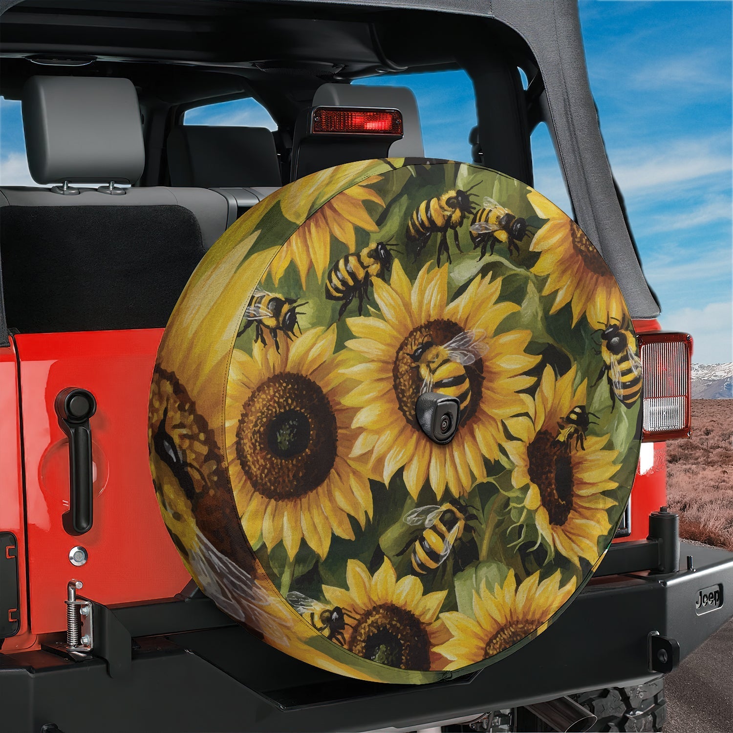 Sunflower bumblebee bliss tire cover on a red Jeep Wrangler with painted bee floral art and camera cutout