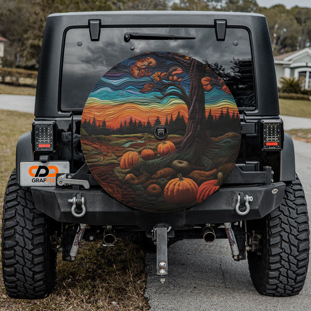 Quilted Halloween pumpkin patch tire cover fabric closeup showing stitched orange pumpkin detail