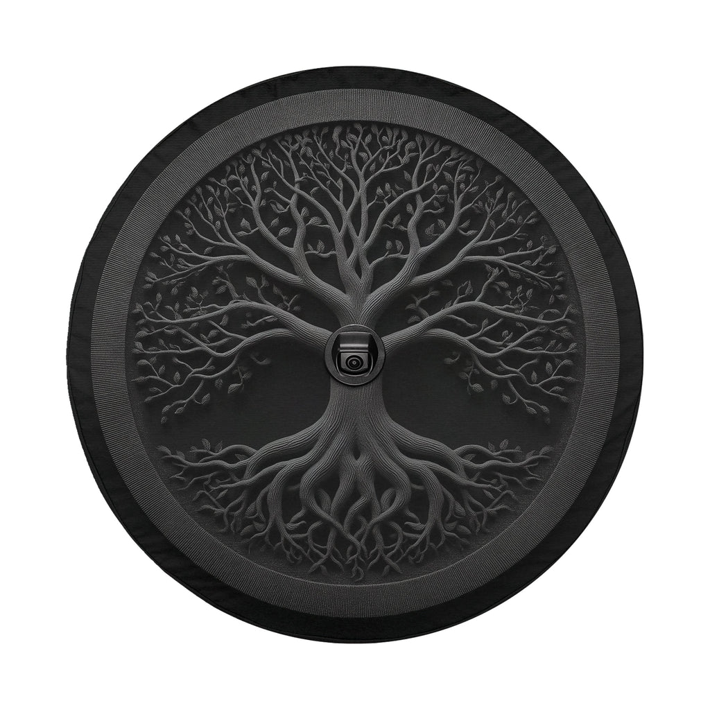 a circular design with a tree-like pattern, including a trunk and branches, encircled by a black border.