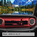 Black mountaineer-with-pickaxe dashboard transfer applied to a red Jeep Wrangler JL/Gladiator JT dash panel