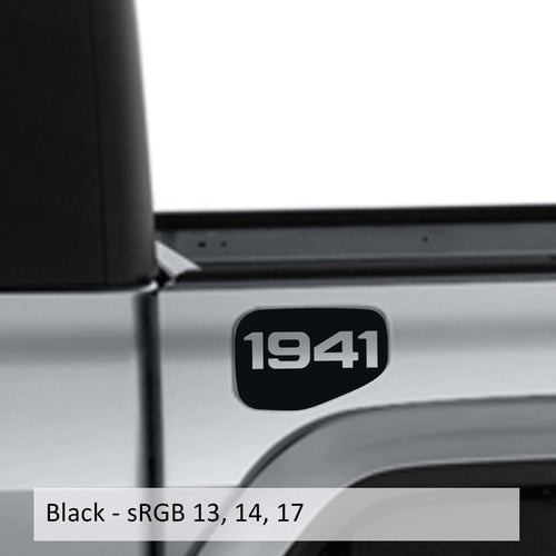 May include: A black truck bed with a black 1941 decal on the side. The truck bed is silver and the decal is in a rounded rectangle shape.