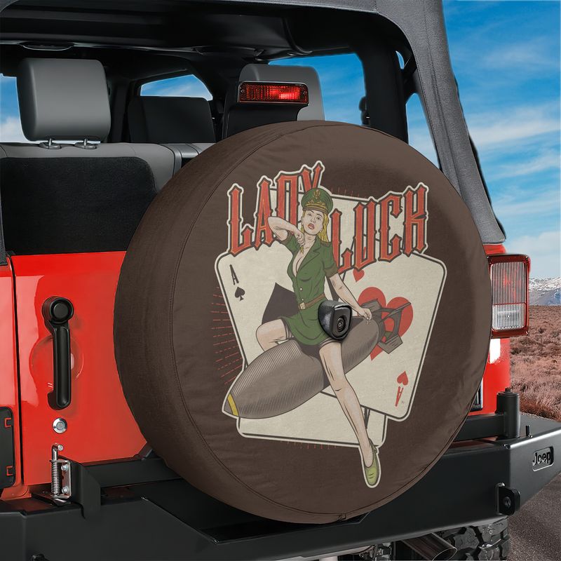 Lady Luck Bombshell spare tire cover with WWII pin-up riding bomb on red Jeep Wrangler