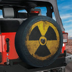 Fallout shelter radiation spare tire cover mounted on a red Ford Bronco tailgate amid red rock desert