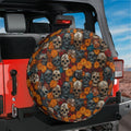 Flowers and skulls tire cover on red Jeep Wrangler with marigold blooms, red roses, and aged human skulls