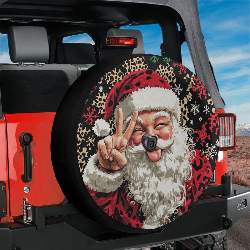 Red Jeep Wrangler rear showing Goofy Santa peace sign leopard snowflake tire cover with camera hole