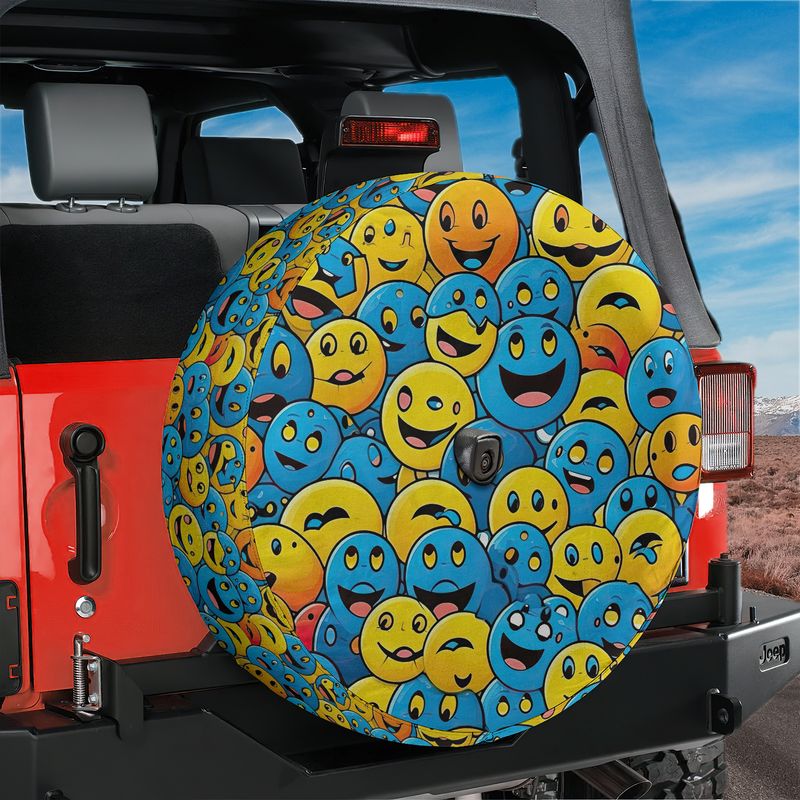 Happy smiley parade tire cover on red Jeep Wrangler showing dense yellow and blue smiling emoji pattern