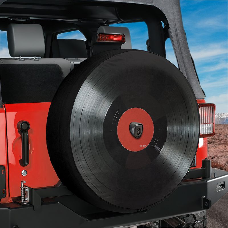 Vinyl Record spare tire cover white background close up of black record grooves and red paper label