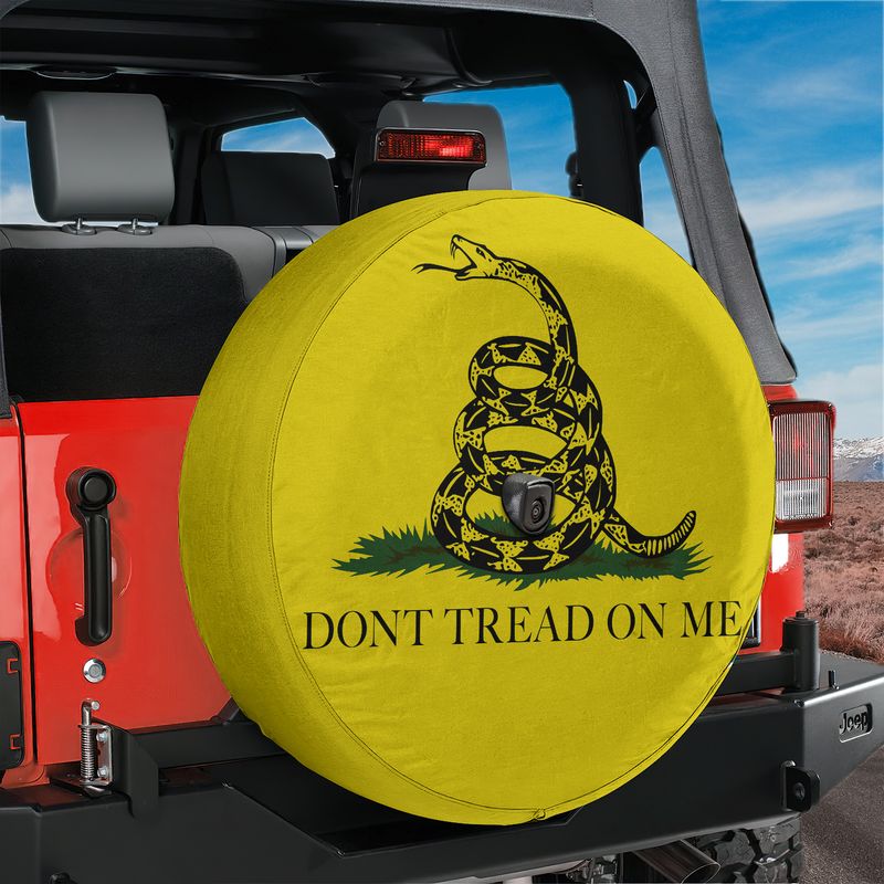 Gadsden Don't Tread on Me tire cover on red Jeep Wrangler with black coiled rattlesnake and bold lettering