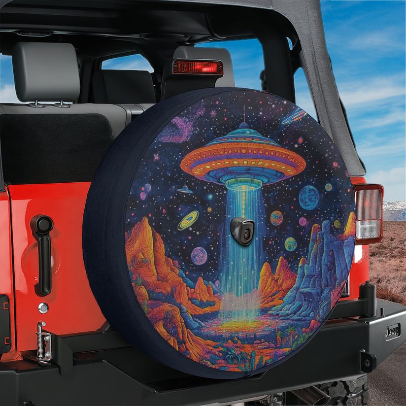 Starport Odyssey UFO spare tire cover on red Jeep Wrangler with alien landscape print