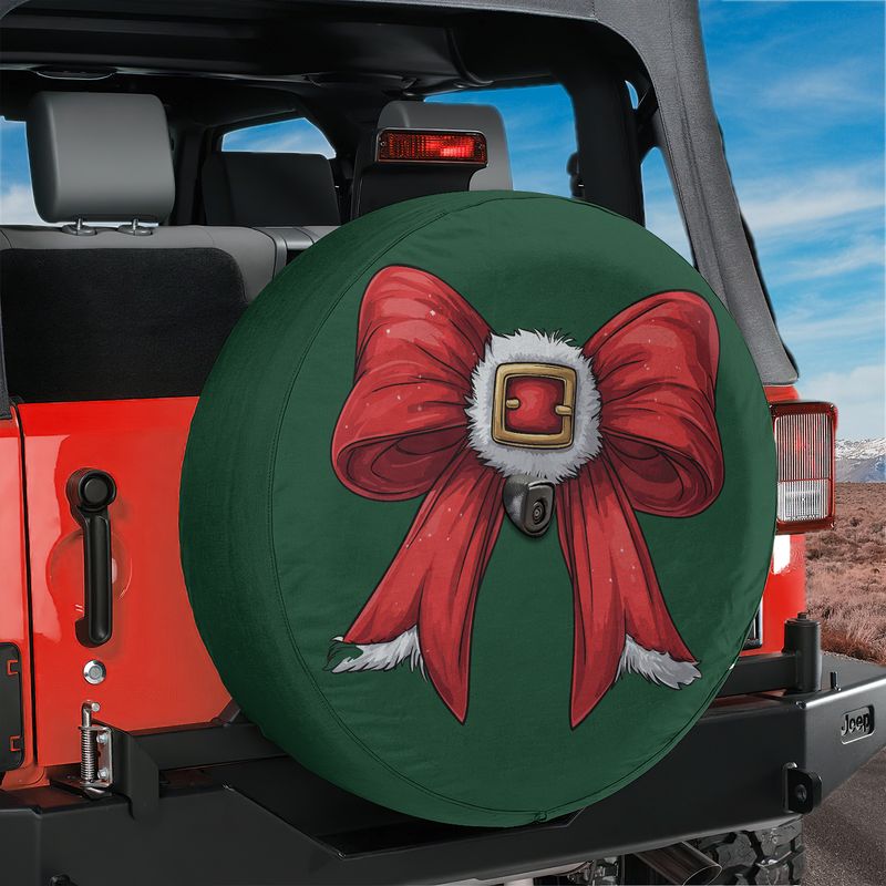 Coquette Santa bow spare tire cover on red Jeep Wrangler featuring green fabric red ribbon gold buckle