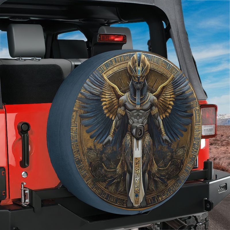 Egyptian pharaoh winged deity spare tire cover mounted on a red Ford Bronco tailgate amid red rock canyons