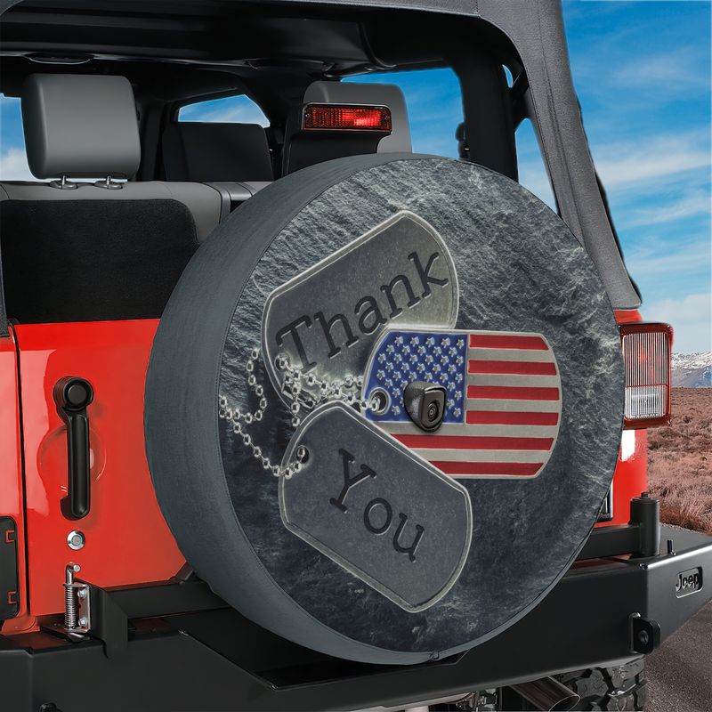 Veterans tribute spare tire cover with dog tags and American flag mounted on a red Ford Bronco rear tailgate