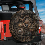 Steampunk gears tire cover on red Jeep Wrangler showing backup camera cutout through bronze sprockets