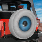 Eye On You spare tire cover product shot showing the round blue iris artwork ready for Jeep or Bronco fitment
