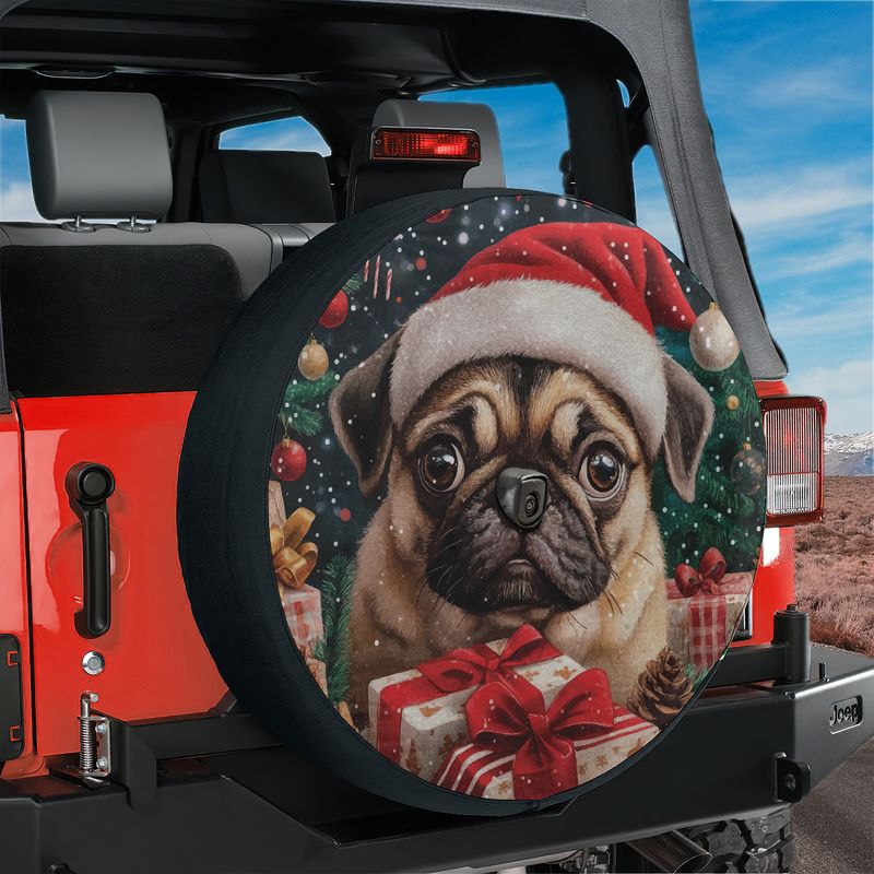 Pug in a red Santa hat surrounded by ornaments tire cover shown on a black Jeep Wrangler tailgate