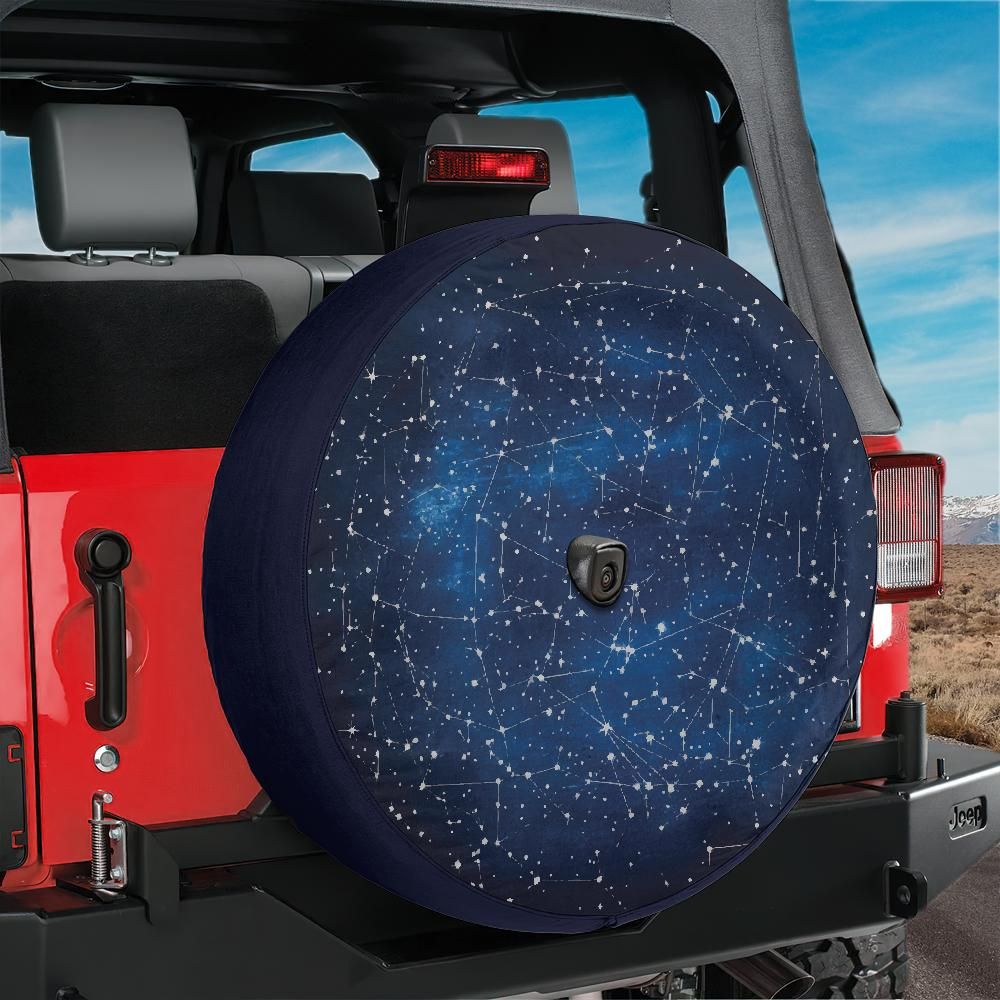 Constellation star map spare tire cover mounted on red Bronco with starry galaxy artwork on rear