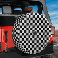 Black and white checkered board spare tire cover shown mounted on red Jeep Wrangler back