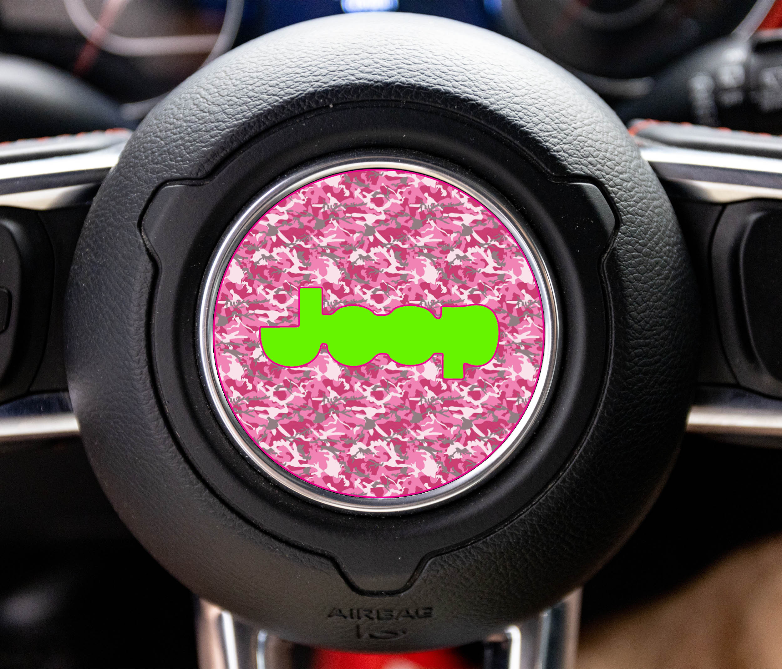 Pink digital camouflage Jeep steering wheel center decal with bright green Jeep logo on circular overlay