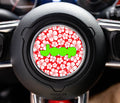 Tropical red hibiscus pattern Jeep wordmark steering wheel center-cap overlay in lime green on Wrangler hub