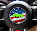 Wavy American flag stars and stripes Jeep steering wheel airbag center decal overlay shown installed